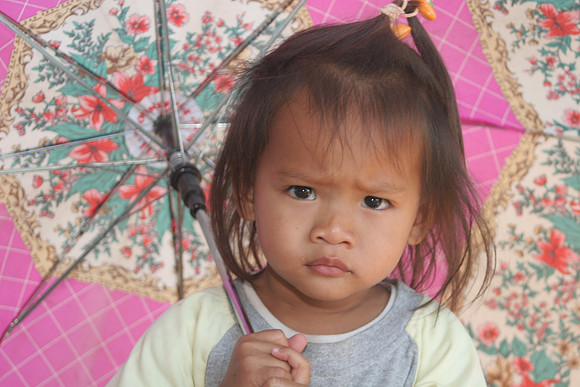 Tot with umbrella, Thailand